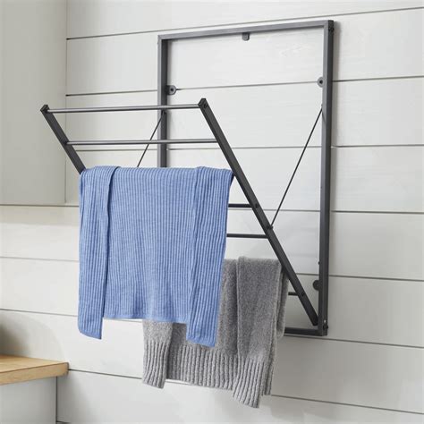 Hanging bars fold flat when not in use and can hang at 45 or 90 degree angles. . Wall mount clothes dryer rack